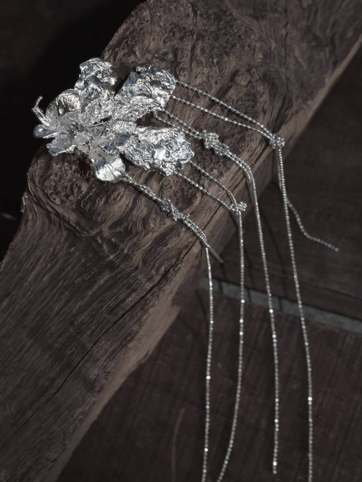 Silver flower earring with chain - single