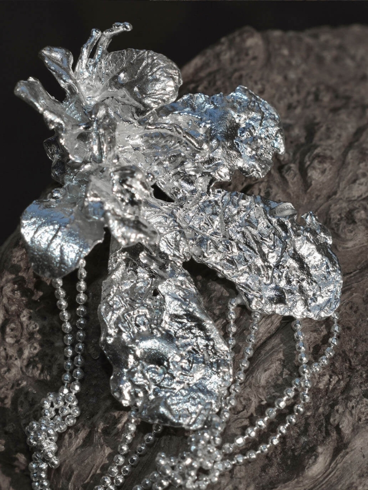 Silver flower earring with chain - single