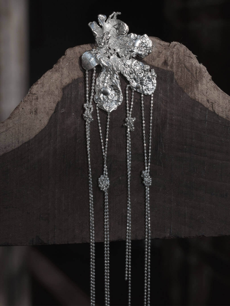 Silver flower earring with chain - single