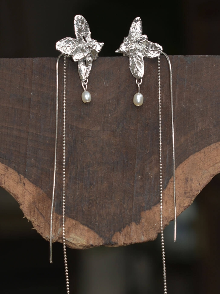 Silver wildflower ear clip with chain - single