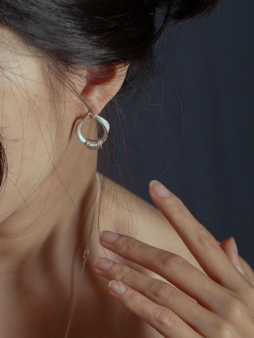 Silver orchid hoop earrings