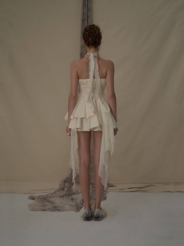 Off-white pleated strapless mini dress