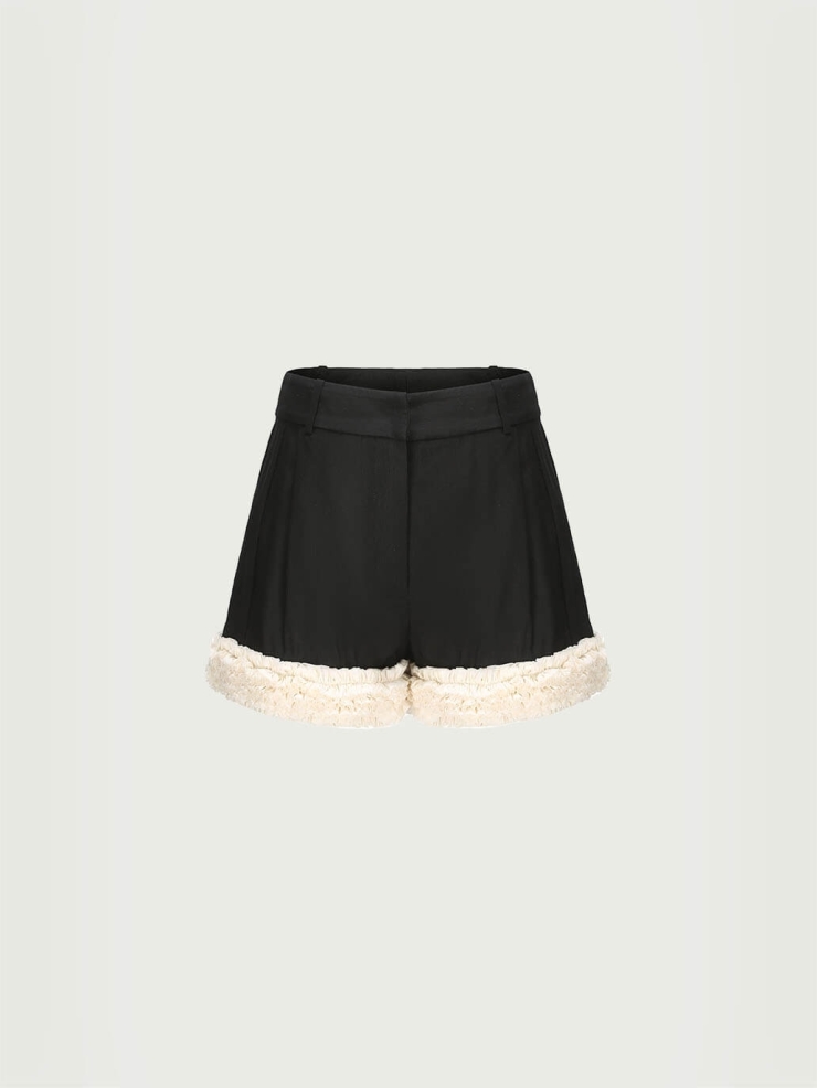 Lace-trimmed black and white color-blocked shorts