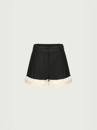 Lace-trimmed black and white color-blocked shorts