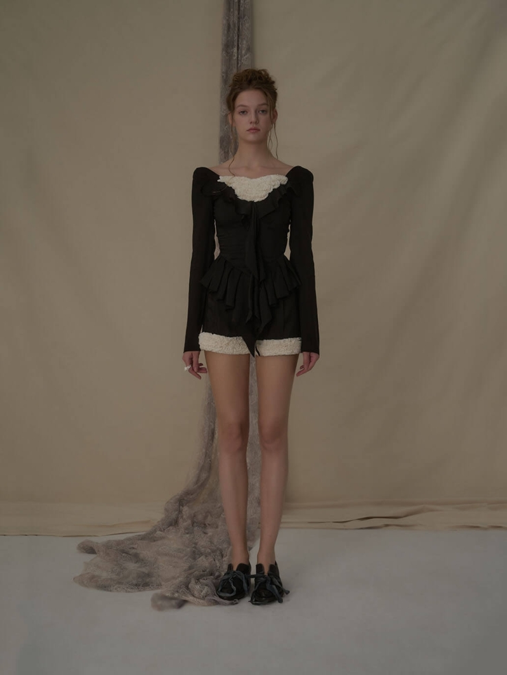 Lace-trimmed black and white color-blocked shorts
