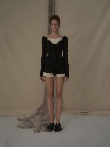 Lace-trimmed black and white color-blocked shorts