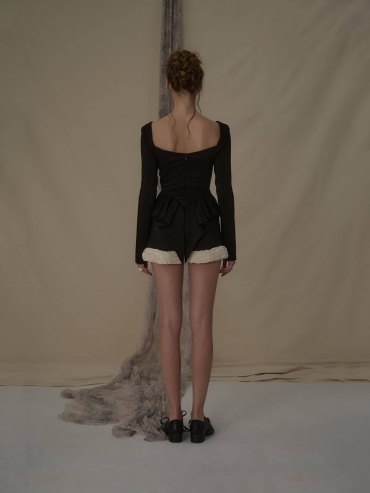 Lace-trimmed black and white color-blocked shorts