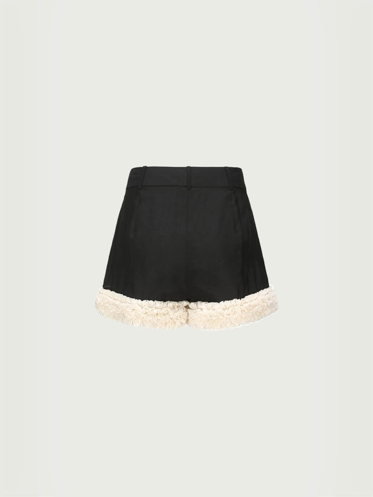 Lace-trimmed black and white color-blocked shorts