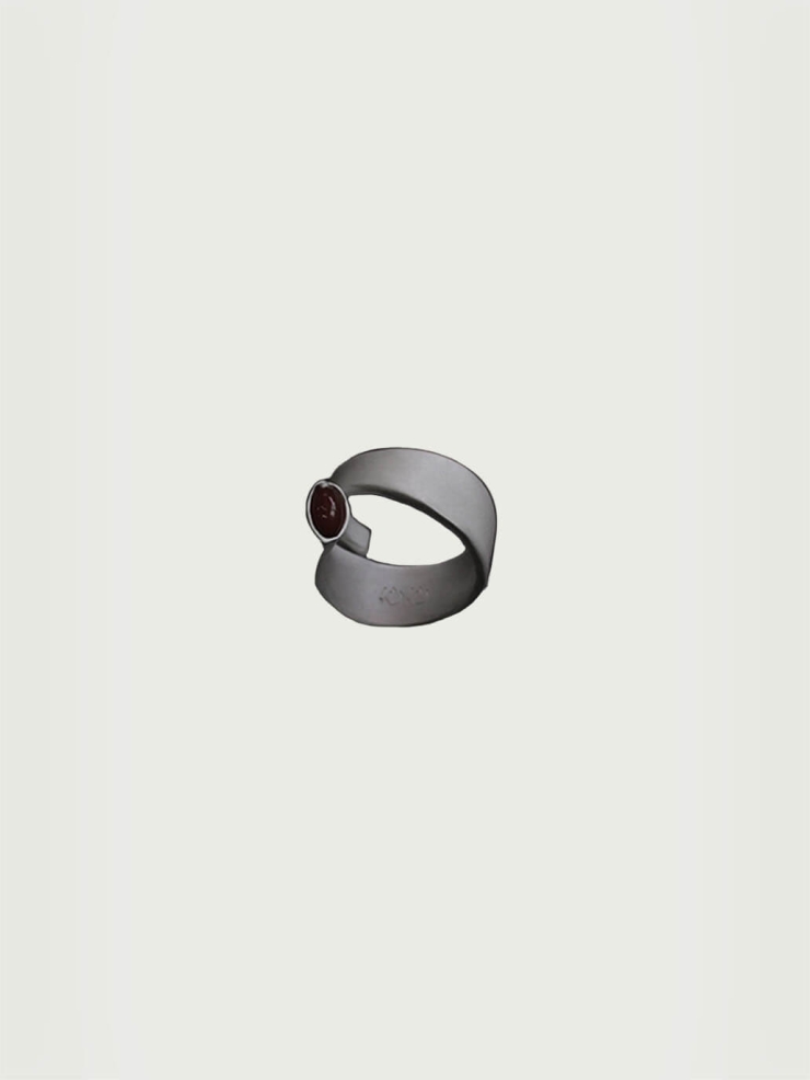 Silver and red revolve amber ring