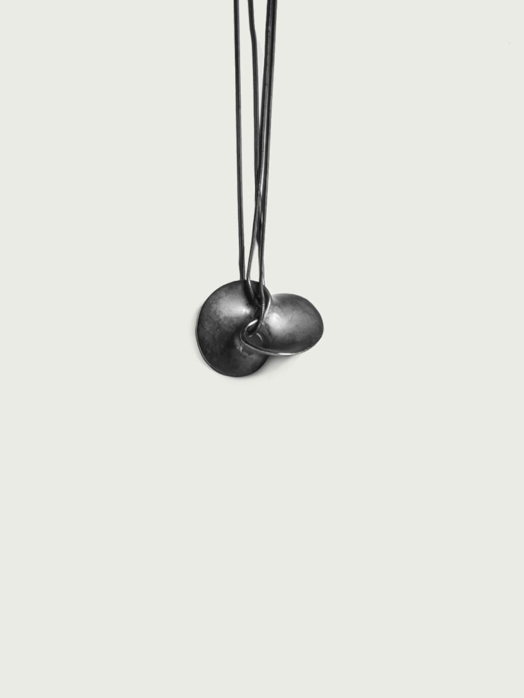 Black wormhole pendant necklace