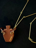 prestashop:1:4437:21584 | Vintage-Style Handcrafted Leather Vase Sculpture Pendant