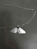 prestashop:1:5431:26153 | Three Eyed Moth Necklace